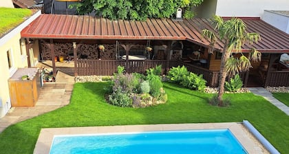 Bright top floor apartment with garden + pool, barbecue + chilling, cycling, hiking and excursions