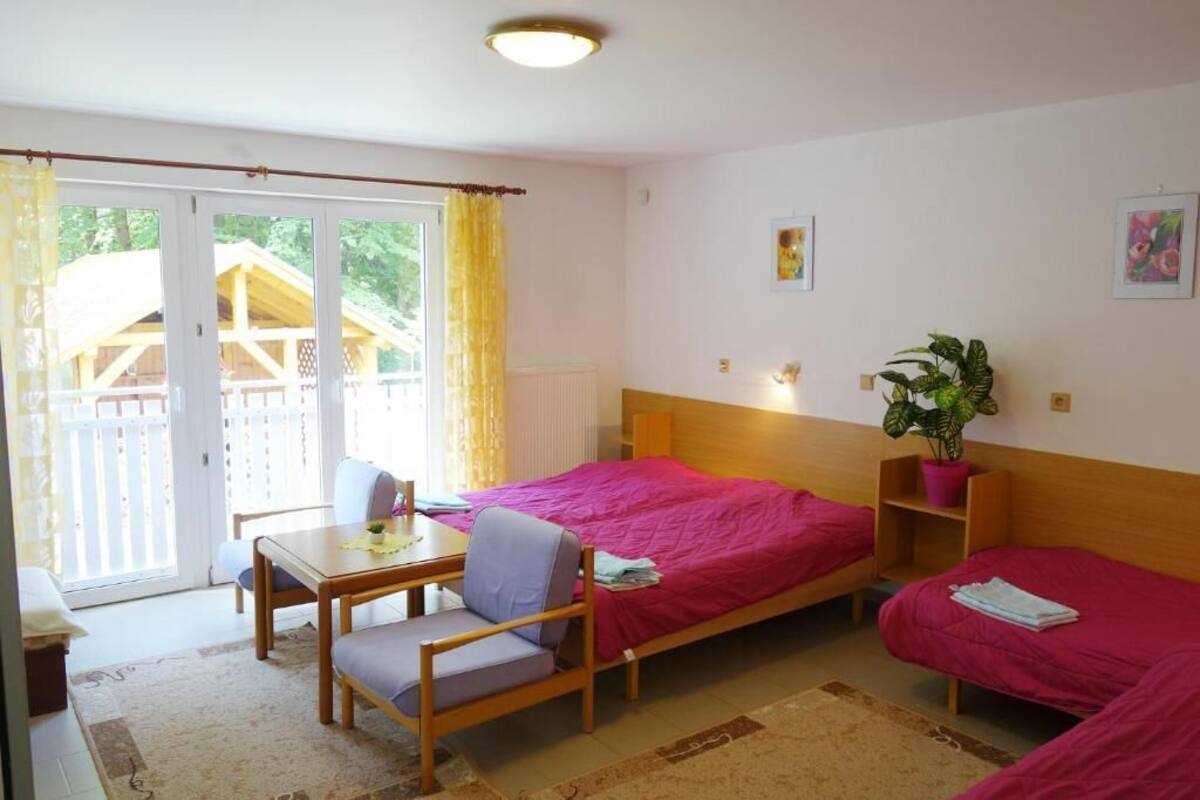Family quadruple room with a garden view