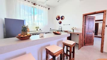 Full-sized fridge, microwave, coffee/tea maker, kitchen islands