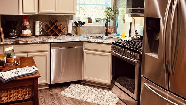 A modern kitchen with stainless steel appliances, a built-in oven, and a microwave. - Dragonfly Inn II 
Fabulous 2BR 1BA modern downtown apt  walk to everything (Winchester)