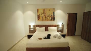 Deluxe Room, City View | Desk, laptop workspace, iron/ironing board, free WiFi