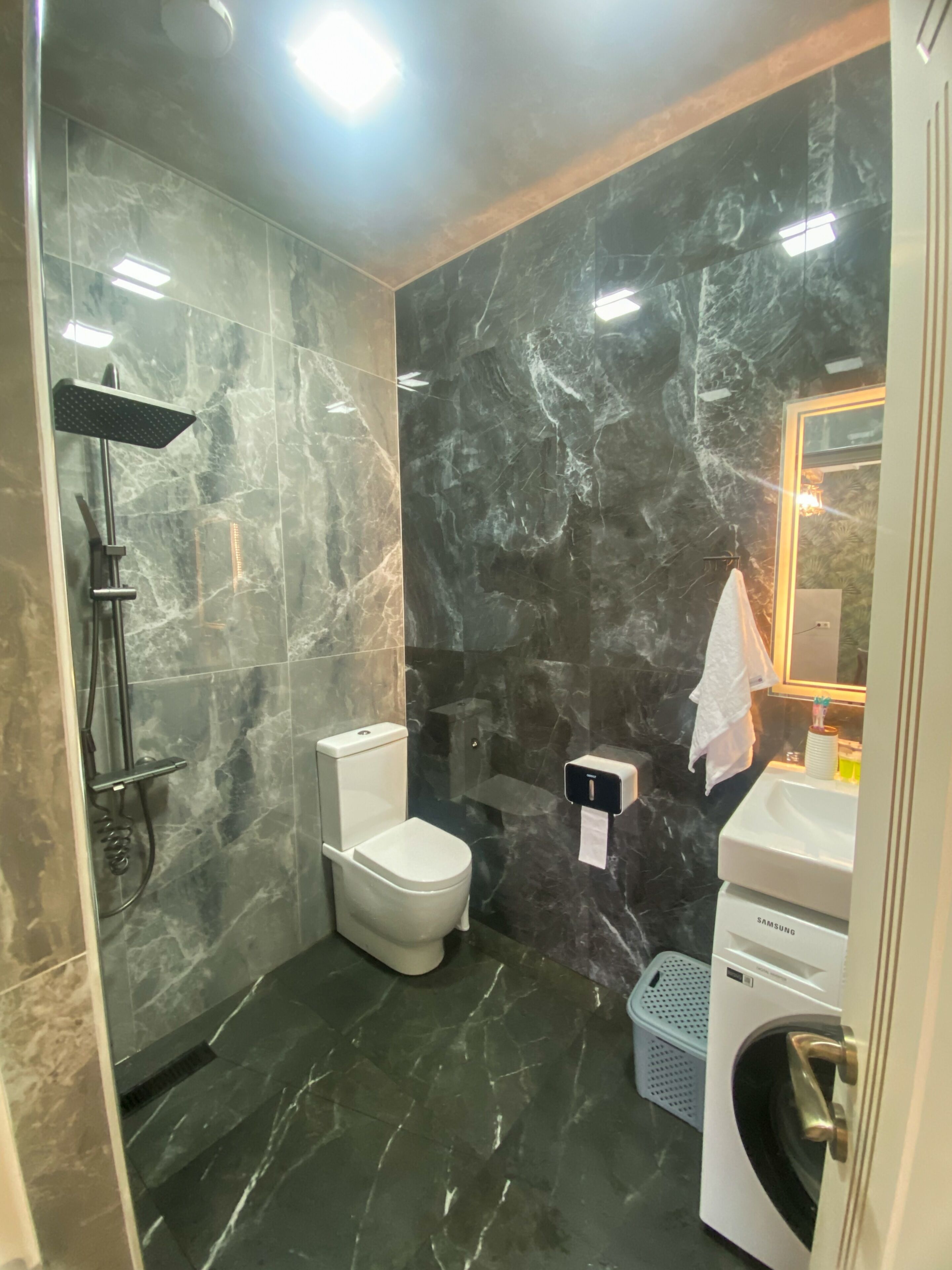 Shower, towels, soap, toilet paper