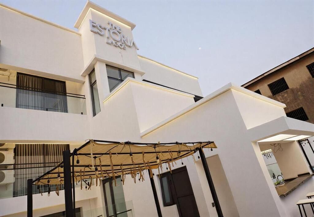 A modern building with a sign reading 'ESTA HOTEL'.