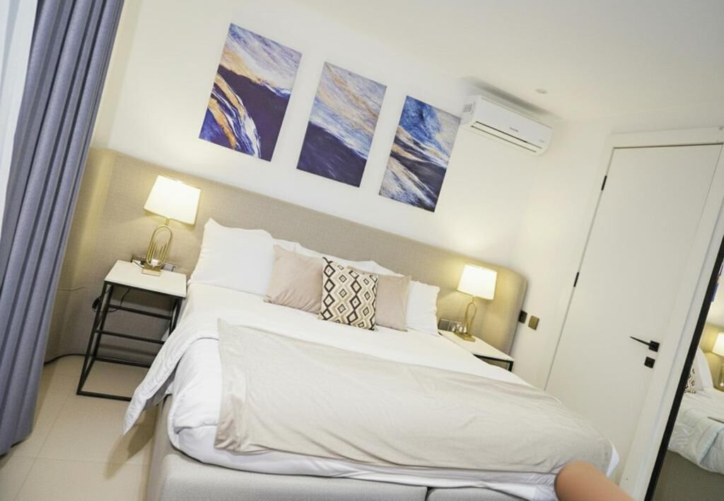 Deluxe Apartment, Balcony, City View | In-room safe, desk, laptop workspace, blackout curtains