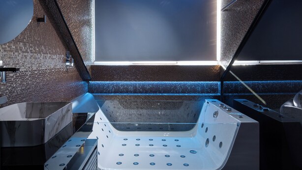 A modern spa room with a large bathtub, wooden ceiling, and a view of the sky. - Forest Park Hotel Krujë (Fushe-Kruje)