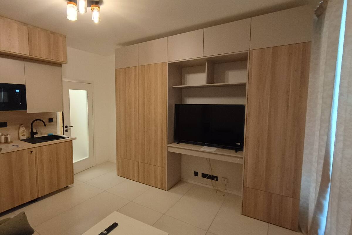 Departamento clásico | Ropa de cama hipoalergénica y tabla de planchar con plancha