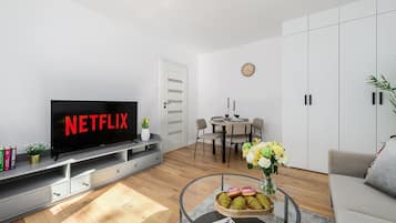 Comfort Apartment, City View | Living area | 50-inch flat-screen TV with cable channels
