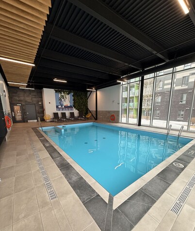 Modern 2BD/2BA Suite at Le Prisme w/ Indoor Pool, Gym & Yoga Studio