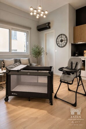 FamilyFriendly Comfort for Little Guests: Traveling with your little one? Enjoy a baby cot and high chair, thoughtfully provided for your convenience. Our cozy, modern apartment offers a welcoming space where families can relax and feel right at home