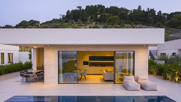 A modern house with a swimming pool, outdoor seating, and a view of the surrounding landscape. - Villa D9 with private pool 1 km from sea (Tkon)