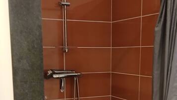 Shower, hair dryer, towels, toilet paper