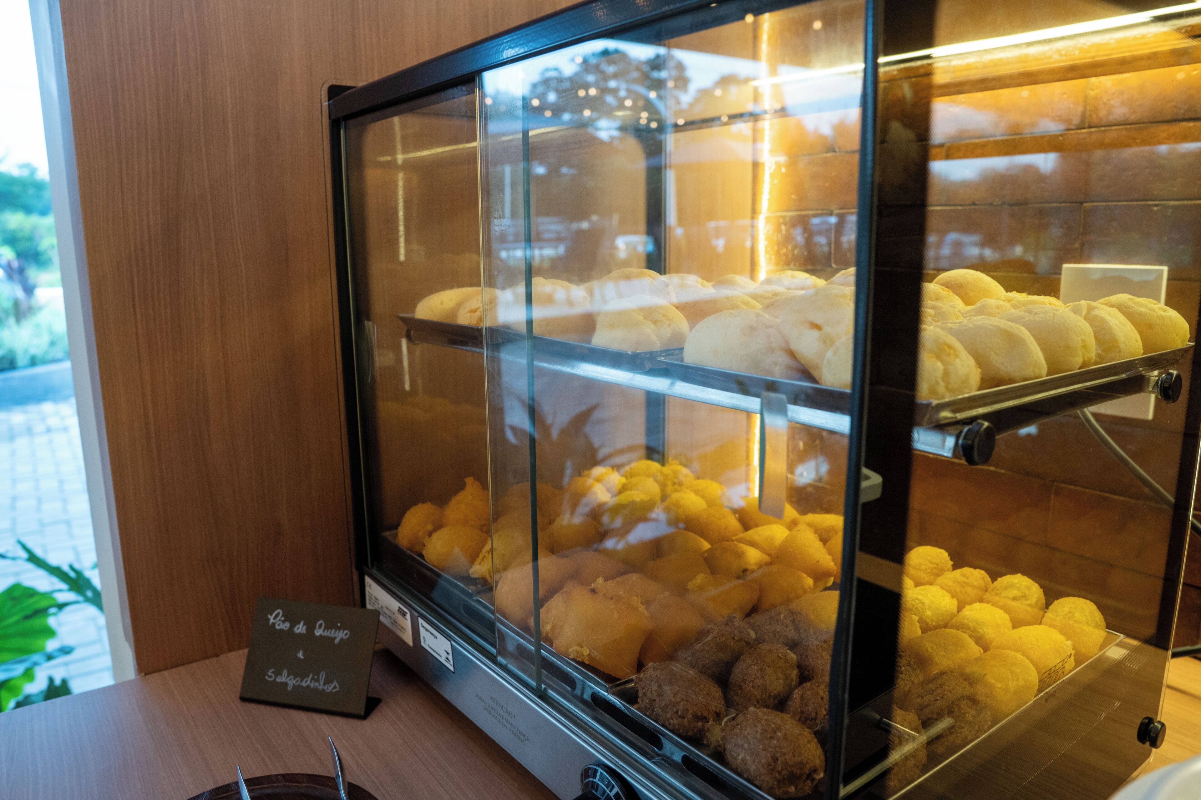 A bakery display case with various baked goods.