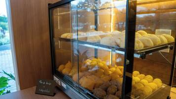 A bakery display case with various baked goods.