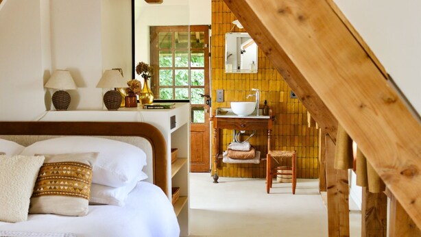 A bedroom with a bed, bedside lamps, a window, and a wooden ceiling. - La Faisane - Five Bedroom Villa, Sleeps 10 (Épaignes)