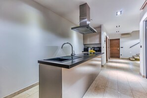 A modern kitchen with a central island, stainless steel appliances, and a sleek design. - Villa Mimice - Four Bedroom Villa, Sleeps 8 (Mimice)