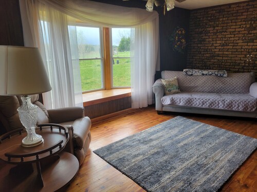 Lovely 2-bedroom farmhouse with central heat/AC in a quiet country setting.