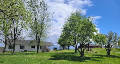 Lovely 2-bedroom farmhouse with central heat/AC in a quiet country setting.