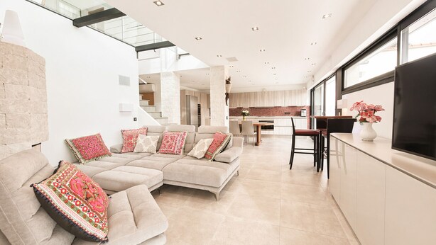 A modern living room with a sofa set, a dining area, and a kitchen. - Peaceful Villa with Pool, Jacuzzi & Gym (Antibes)