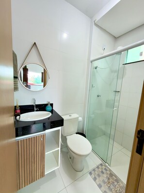 Shower, towels, soap, toilet paper