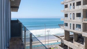 A view of the ocean from a balcony with a clear sky. - Contemporary Condo with Ocean Views (Mazatlan)