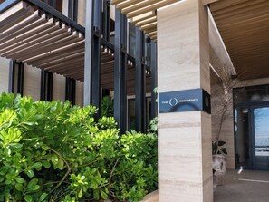 A modern building with a sign reading 'THE O RESIDENCE.' - Luxury apt on the Malecón with lagoon views (Mazatlan)