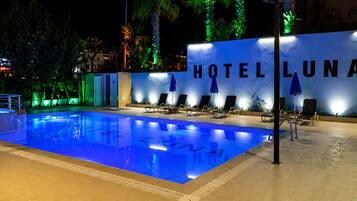 Seasonal outdoor pool, pool umbrellas, sun loungers