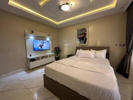 Family Room, Balcony, City View | Desk, laptop workspace, blackout drapes, soundproofing