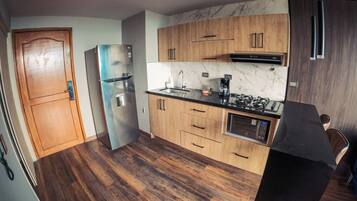 Apartment, Kitchenette, City View | Private kitchen