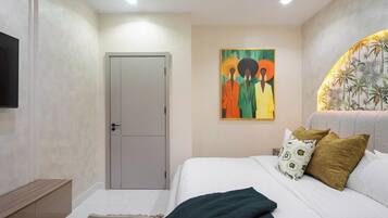 Deluxe Apartment, Balcony, City View | In-room safe, desk, laptop workspace, blackout drapes
