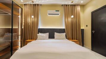 Deluxe Apartment, Balcony, City View | In-room safe, desk, laptop workspace, blackout drapes