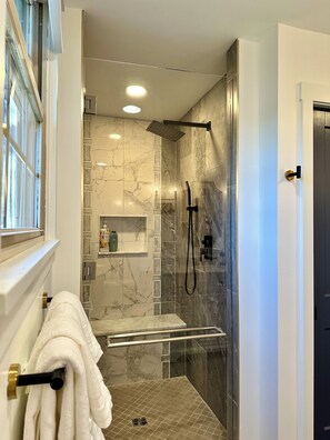 Shower, hair dryer, towels, soap