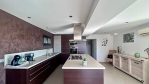 A modern kitchen with a central island, built-in appliances, and a sleek design. - 🌴 SPECIAL SUMMER CLOSING SALE: 30% off from August 22 to August 29 🌴 (Ollioules)