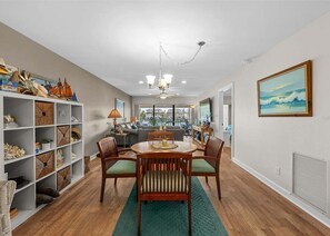 A dining area with a round table, chairs, and a chandelier. - 5 Minutes to the beach!
Beautiful 2-bedroom Condo in St Pete (St. Petersburg)