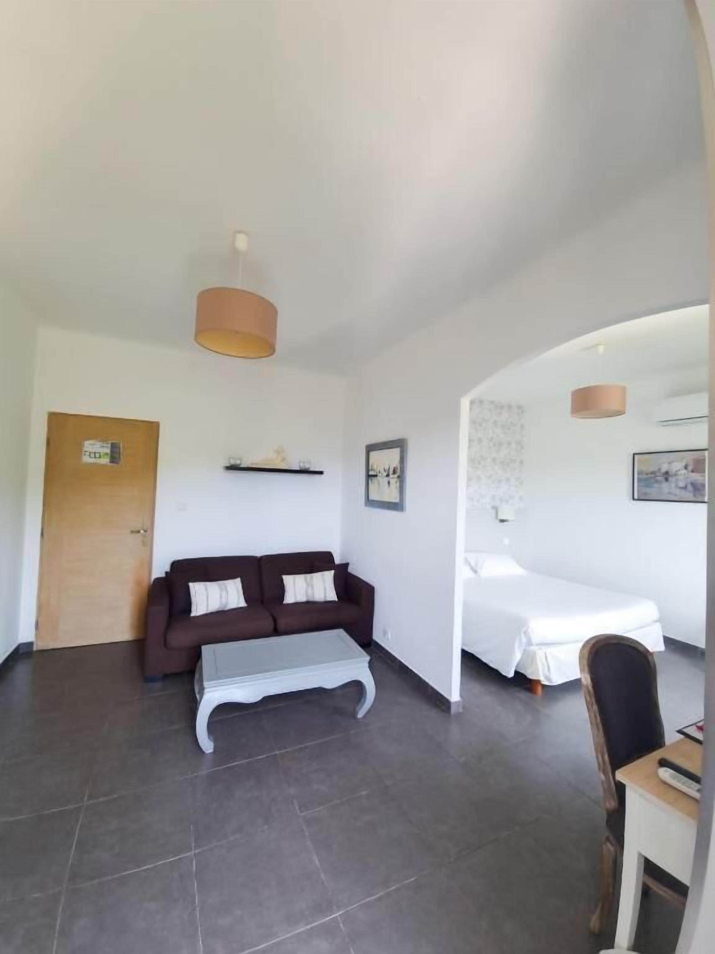 Suite familiare, balcone, vista montagna | Area soggiorno