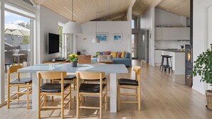 A modern interior with a dining area, kitchen, and living space. - "Minka" - 500m from the sea by Interhome (Blokhus)