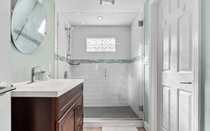 Shower, towels, soap, toilet paper