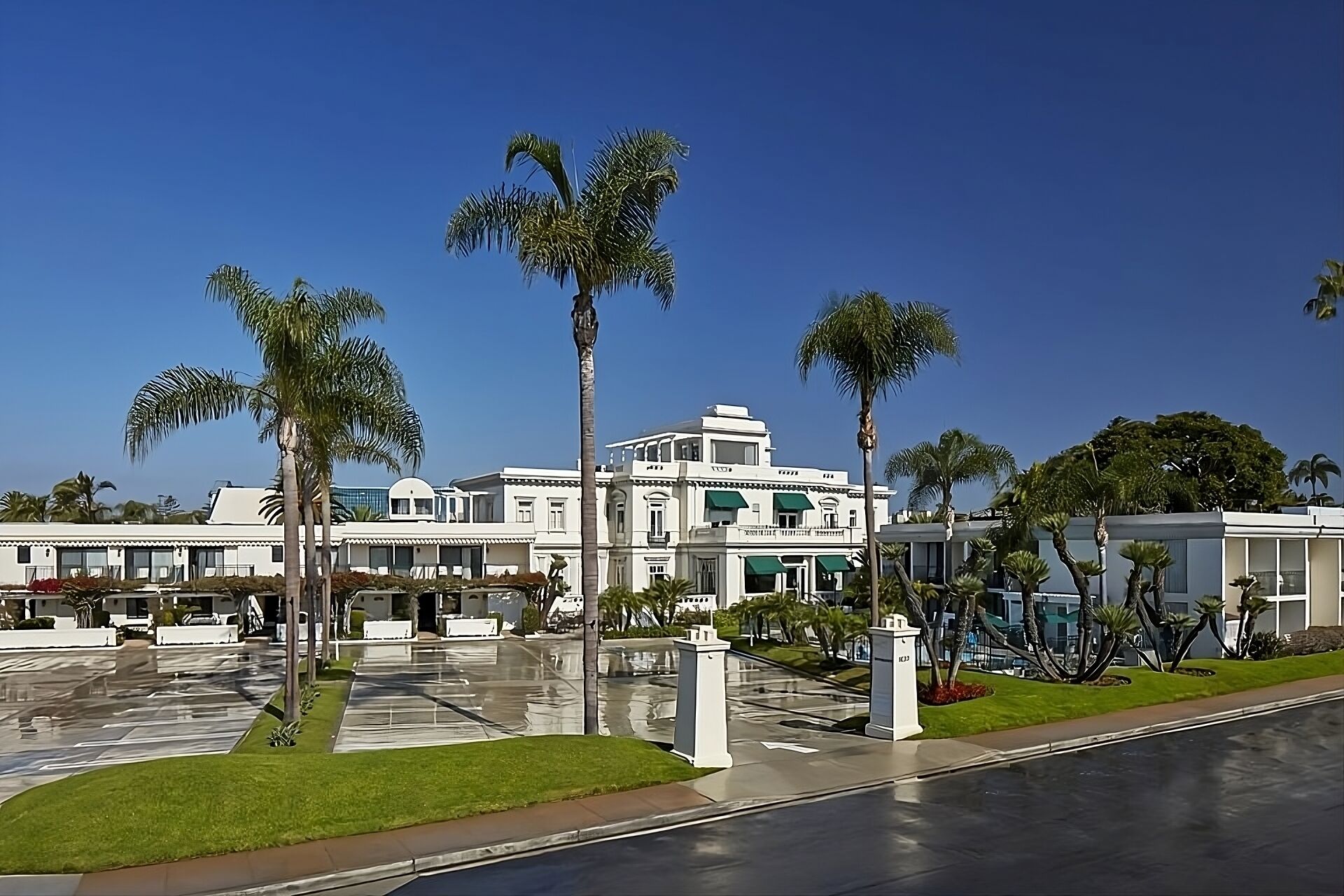 Arrive to a grand palm-lined exterior with resort-style charm.