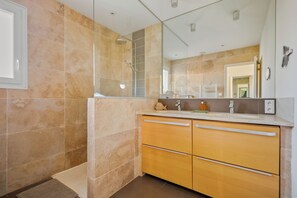Shower, hair dryer, towels, toilet paper