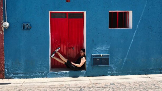 A blue building with a red door, a small window, and a number '208' sign. - Casita on quiet street just 15 minute walk to historic center. (Oaxaca de Juárez)