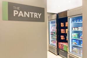 A pantry with two refrigerators stocked with beverages and snacks. - 2BR 2 Queen Suite | Sofa Bed + Two Baths (Vaughan)