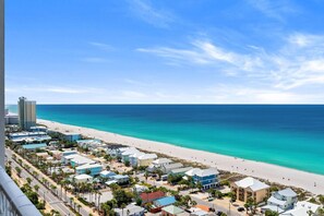 A coastal town with a beach, buildings, and a clear sky. - Gulf View Resort Penthouse Condo! Beach & Pools (Panama City Beach)