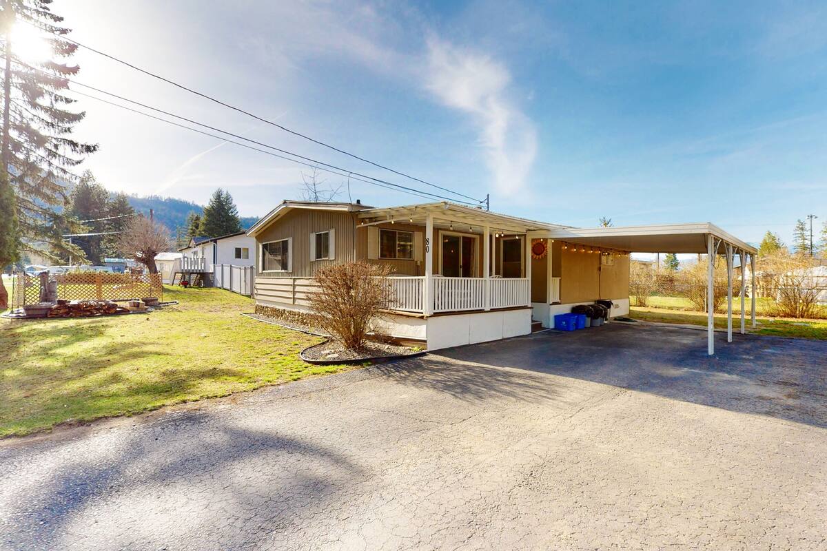 A single-story house with a covered porch and a garage.