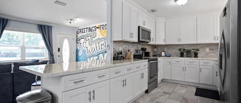 Coffee/tea maker, fridge, microwave, oven