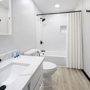 Shower, hair dryer, towels, soap