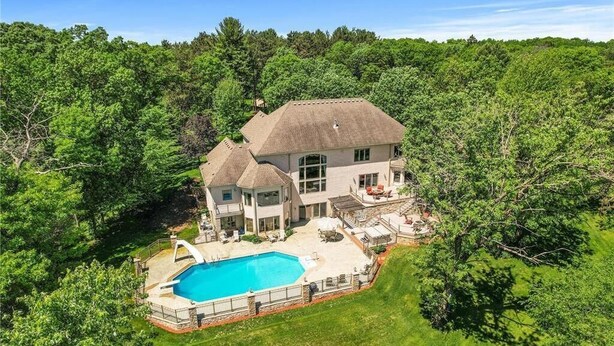 A large house with a swimming pool, surrounded by dense forest. - LL Unit w/ Private Access in Luxurious Riverfront Vacation Home (Oak Grove)