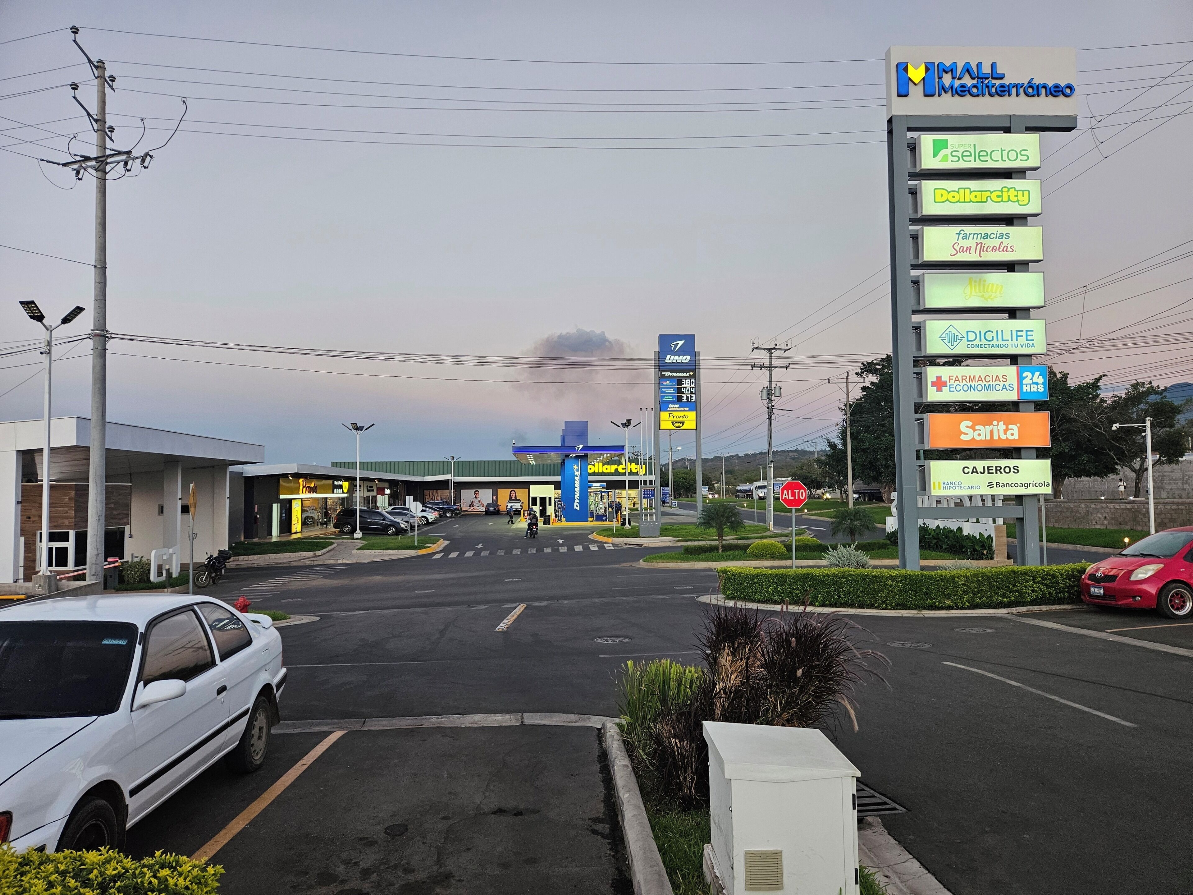 A commercial area with a gas station, a pharmacy, and a supermarket.