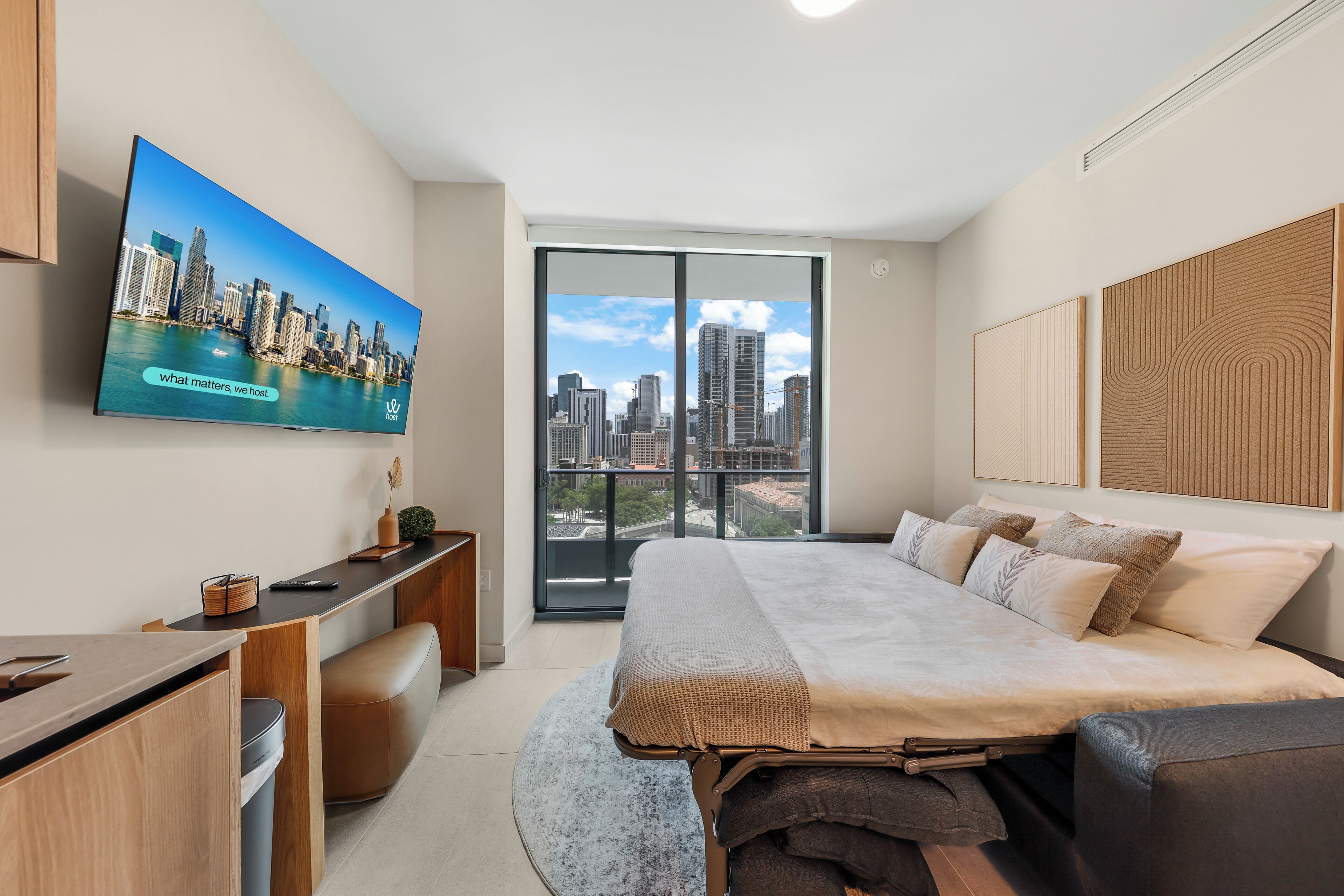 Apartment, 1 Bedroom, Balcony, City View | Living area | 50-inch Smart TV with cable channels