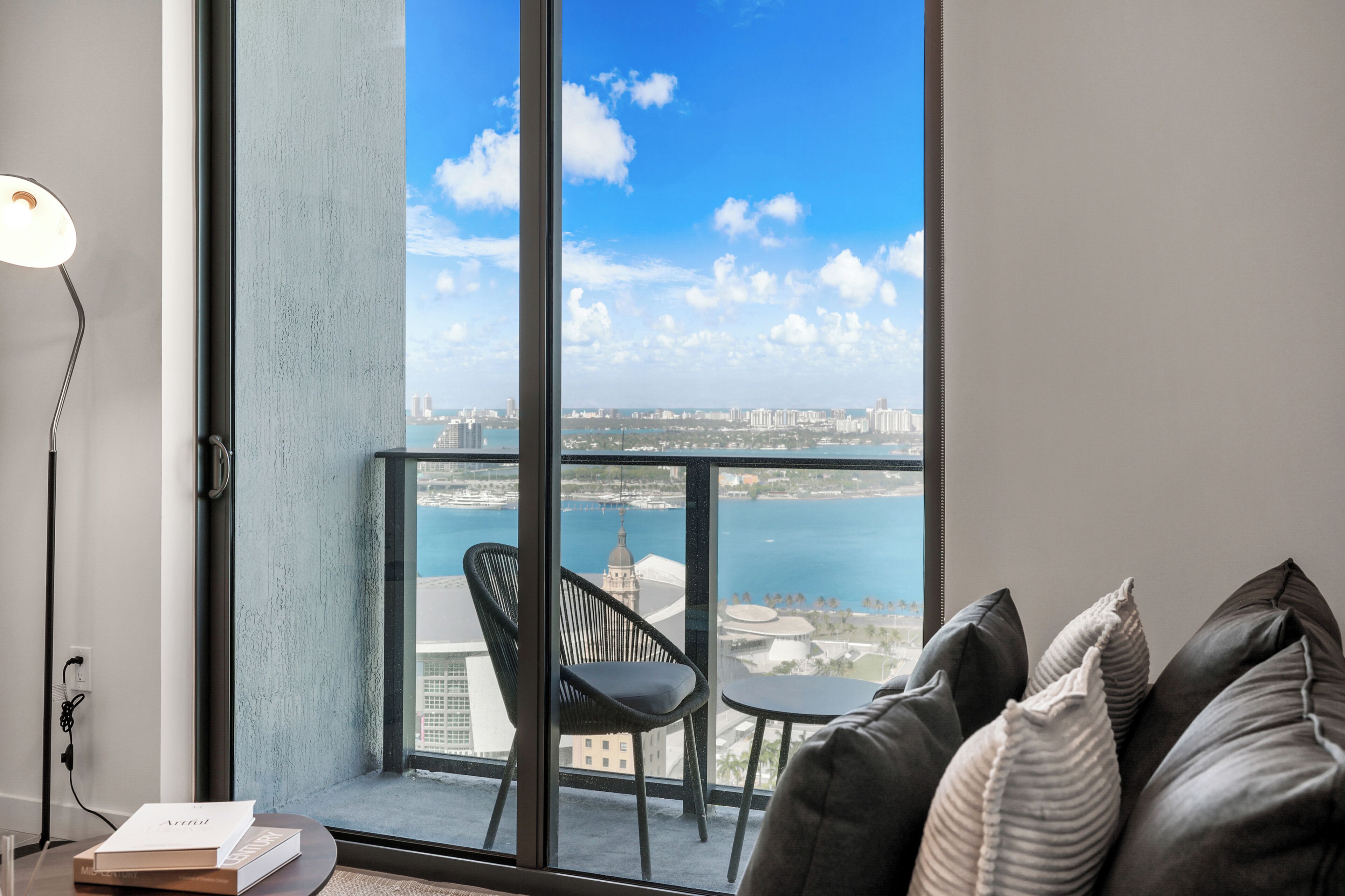 Apartment, Balcony, City View | Living area | 50-inch Smart TV with cable channels