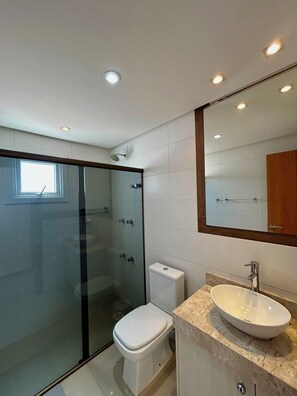 Bidet, towels, soap, toilet paper