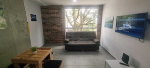 Standard Apartment, City View | Living area | 34-inch Smart TV with cable channels - ColdAC fast Wifi best Laureles location  (Medellín)